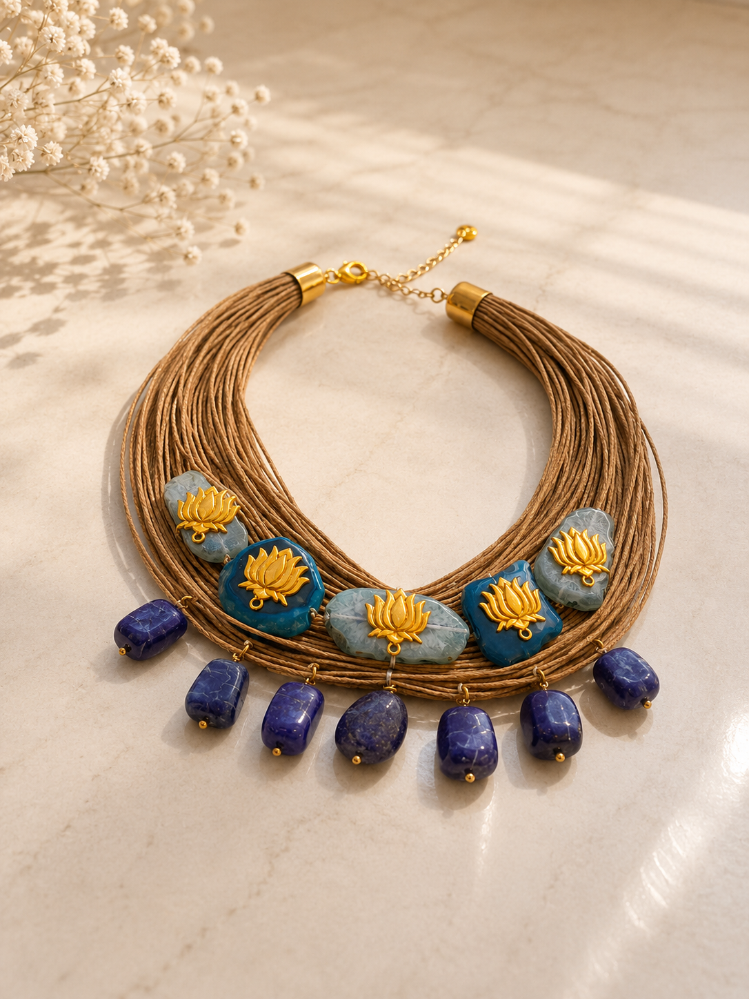 Dor Azure Lotus - layered cord necklace with blue stones and gold lotus detailing