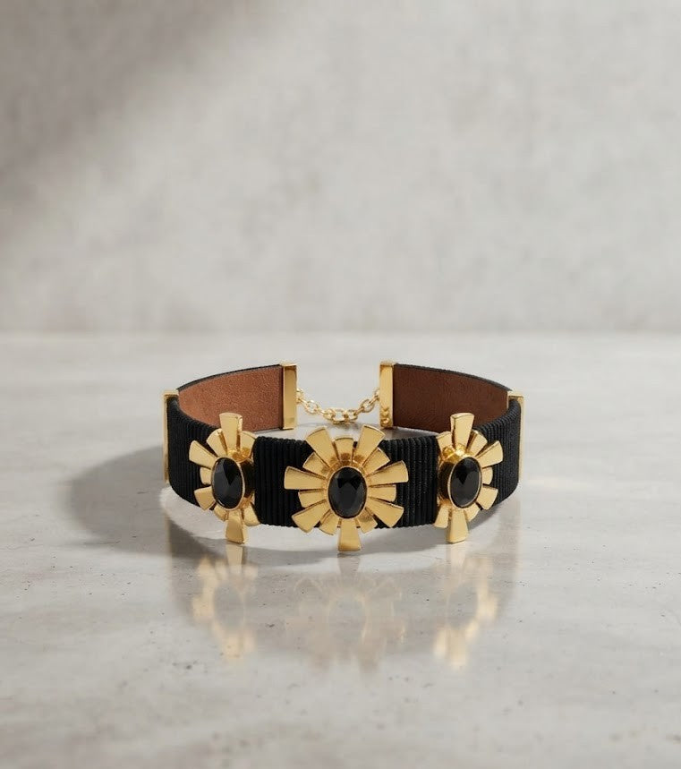 Metal Blast Midnight Flare Collar Choker - black leather band with gold sunburst motifs