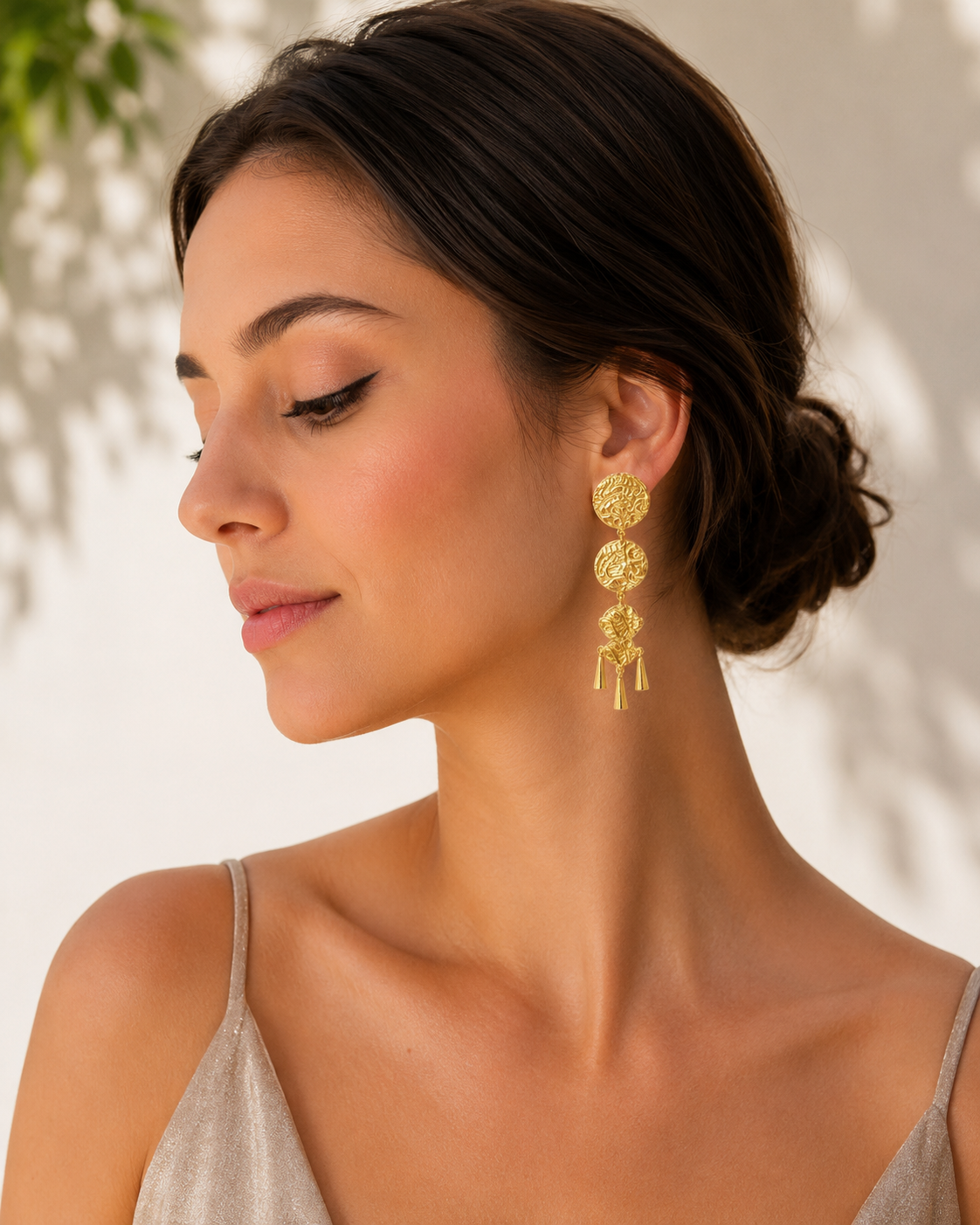 The Cascading Coin Dangles – model wearing three-tier gold coin dangle earrings