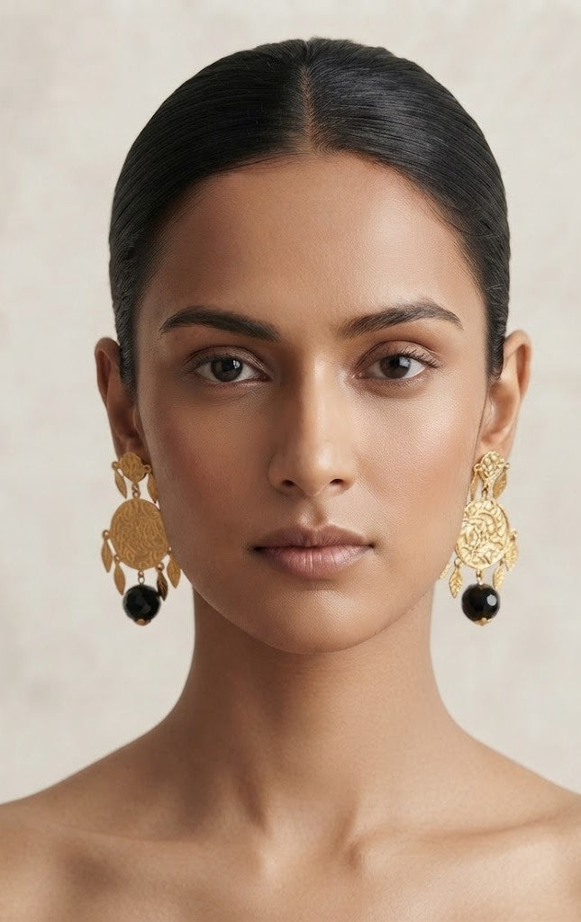 Gilded Sahitya Earrings – model wearing antique gold coin and black bead drop earrings